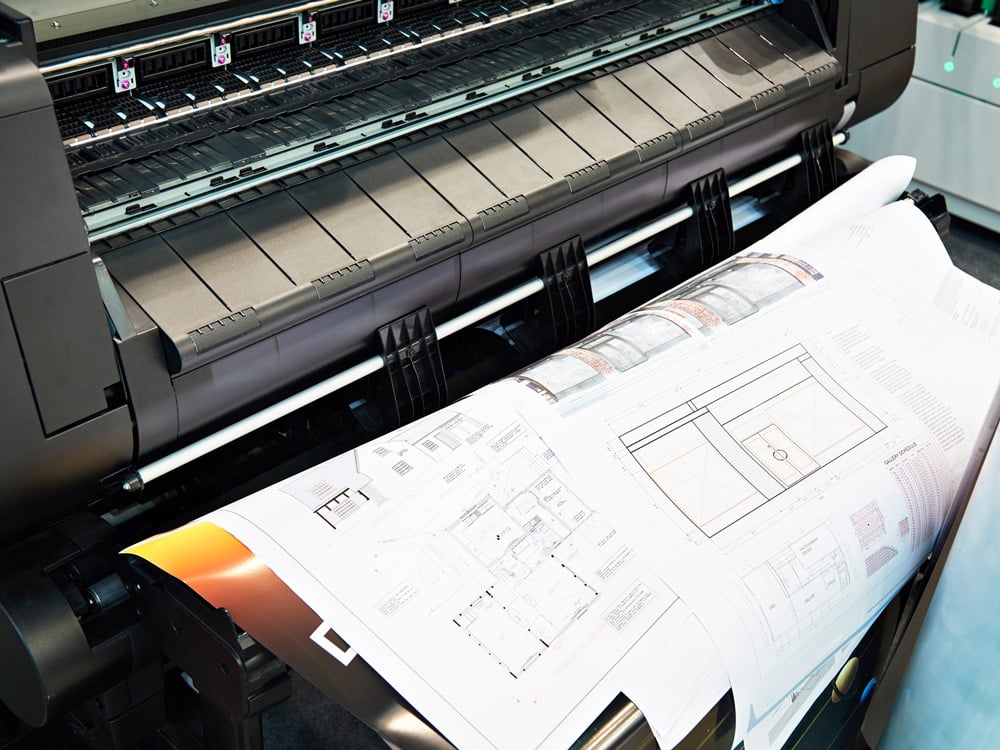 stock-photo-large-format-plotter-and-printed-drawings-floor-plans-1494706304