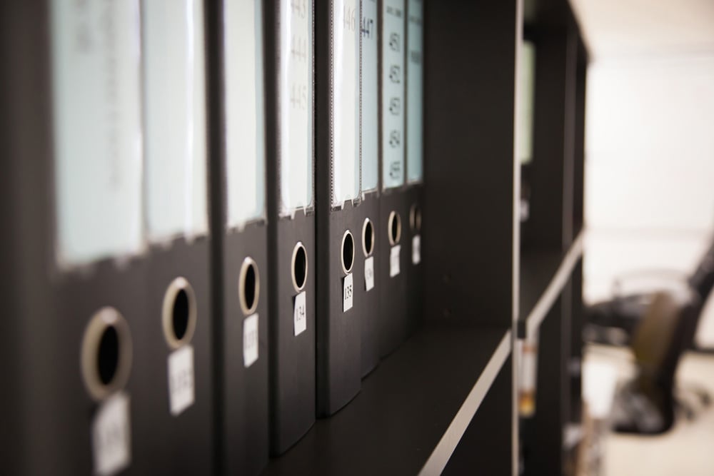 stock-photo-many-files-folder-store-in-the-office-shelf-590419064